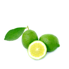 Fototapeta na wymiar Closeup Fresh lime and citrus-fruit of lime slices with green leaf isolated on white background
