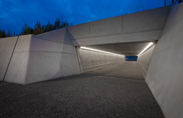 Modern tunnel voor bicycles Harderwijk Netherlands. Twilight. Viaduct.