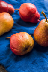 Fresh and ripe sliced pears on the rustic background. Selective focus. Shallow depth of field.
