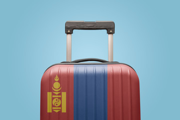 Baggage with Mongolia flag print tourism and vacation concept.