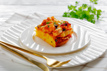 Restaurant serving of chicken tamale pie, close-up