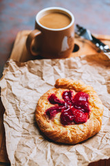 Sweet homemade creamy tart with glazed strawberry. Selective focus. Shallow depth of field.