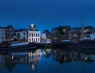 Deurstickers City of Schiedam at night. Twilight. Harbour and boats. © A
