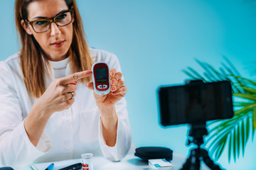 Telehealth – Medical doctor recording video instructions for patient and  demonstrating how to...