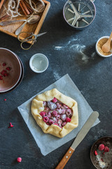 Rustic baking ingredients and kitchen utensils. Homemade pastry, baking. Top view flat lay background. Healthy fresh organic food.