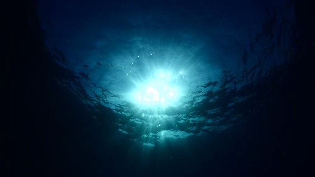 sun ray and sun beam scenery underwater waves on surface of water slow
