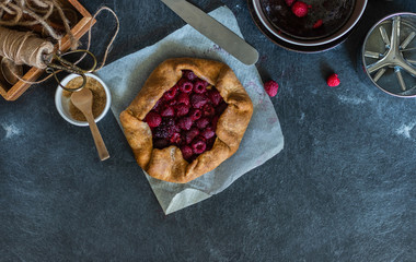 Rustic baking ingredients and kitchen utensils. Homemade pastry, baking. Top view flat lay background. Healthy fresh organic food. copy space