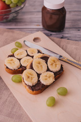 chocolate paste toast with banana for Breakfast, fruit
