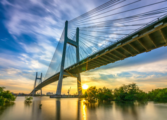 Beautiful sunset landscape at Phu My Bridge. This largest cable-stayed bridge crossing Saigon river connect District 2 and 7 in Ho Chi Minh City, Vietnam