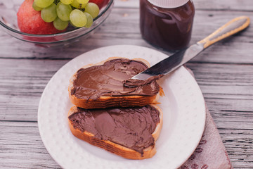 chocolate paste toast with banana for Breakfast, fruit