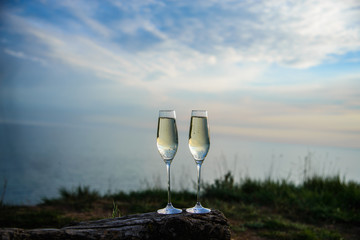 
champagne glasses at sunset