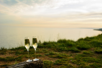 
champagne glasses at sunset