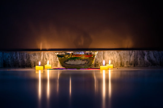 Happy Diwali - rangoli painting on floor for diwali with floating candles
- Powered by Adobe