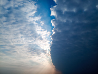 boundary of atmospheric fronts. The sharp boundary of the clouds in the sky.
