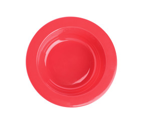 Red plastic baby plate isolated on white, top view. First food