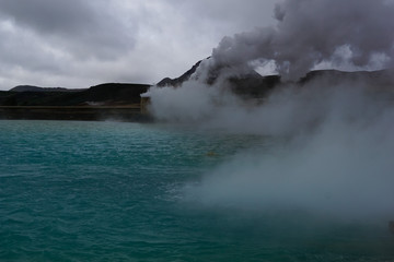 Blue volcanic lake and hor spring in Krafla caldera in North Iceland
