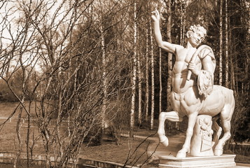 Marble sculpture of  centaur (copy) on  bridge in Pavlovsky Park. Sepia - obrazy, fototapety, plakaty