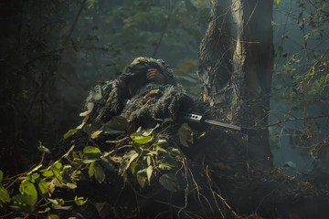 soldier with a rifle.Army soldier in protective uniform holding rifle .special forces soldier...
