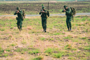 soldier with a rifle.Army soldier in protective uniform holding rifle .special forces soldier...