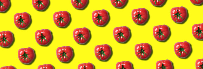 Red tomato pattern on trendy yellow background with copy space. Top view. Flat lay. Creative packing design. Summer minimal concept. Vegan and vegetarian diet