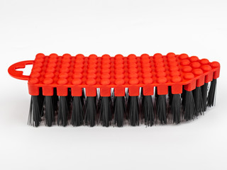 Fototapeta premium red brush for washing various surfaces with a plastic body and artificial bristles