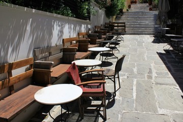 Athens, Greece, May 6 2020 - Empty cafe-restaurant during the Coronavirus lockdown.