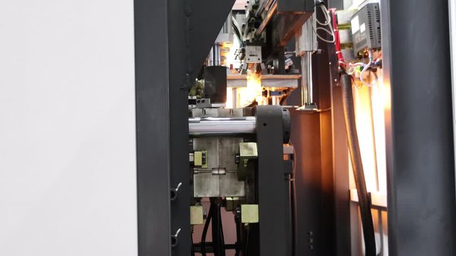 Manufacturing of  plastic bottle by hot blow injection process