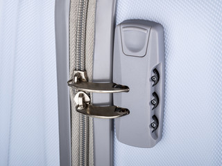 grey mother of pearl suitcase on wheels for leisure travel