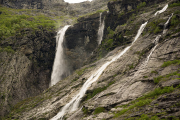 Krunefossen waterfall in Kjenndalsbreen valley and Lovatnet lake valley near Loen in Norway 