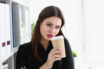 Businesswoman at workplace in office portrait
