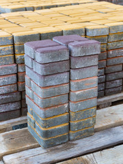 A batch of paving stones of different colors is prepared for styling