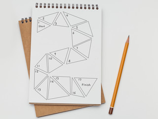 Hand drew board game in a notebook