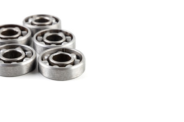 Set of various metal rolling bearing spare part of mechanical on white background. Have copy space.