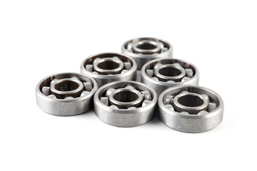 Set of various metal rolling bearing spare part of mechanical on white background.