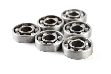 Set of various metal rolling bearing spare part of mechanical on white background.