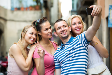 young people taking selfie outdoors .