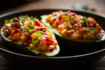 Avocado halves stuffed with tuna fish and vegetables