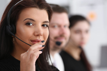 Three call centre service operators at work