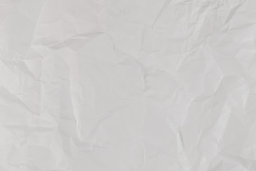 Crumpled white paper background.