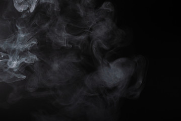 White steam on a black background.