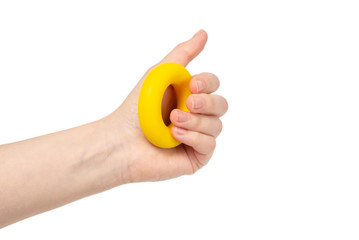 Yellow and orange expander in woman hand isolated on white background.