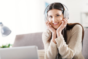 Woman at home with headphones