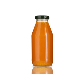 orange juice in glass bottle on white background