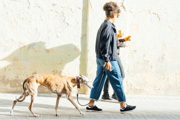 GIRL WALKING WITH DOG