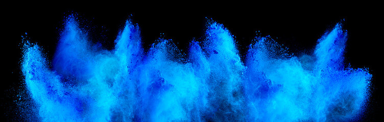 cyan blue holi paint color powder explosion isolated  dark black background. industry beautiful...