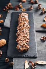 homemade cookies of oats, chocolate and nuts on blackboard
