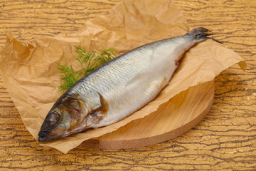 Salted herring over the wooden board