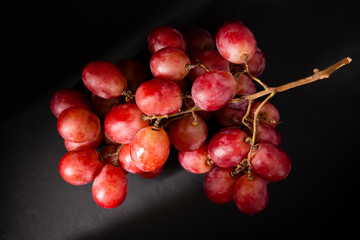 Bunch of table grape on black background