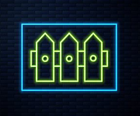 Glowing neon line Garden fence wooden icon isolated on brick wall background. Vector Illustration
