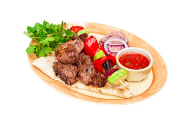 beef barbecue with vegetables  and sauce on plate,  isolated on white, food menu 